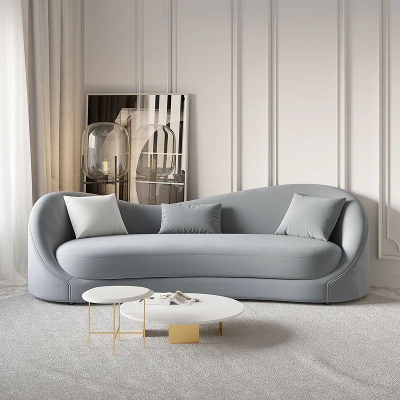 Modern Curved Light Gray Sofa with Accent Pillows